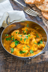 Chicken korma curry with naan bread - high angle view