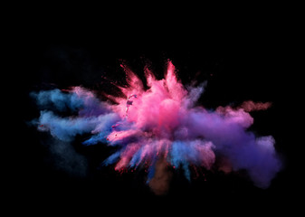 Fantastic forms of powder paint and flour combined  together explode in front of a black background...