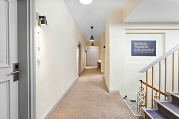 Modern hotel corridor with elegant staircase