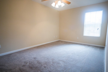 Empty Bedroom in Small House Apartment With Ceiling Fan