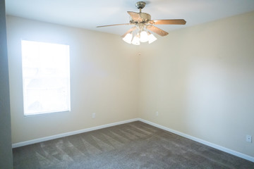 Empty Bedroom in Small House Apartment With Ceiling Fan