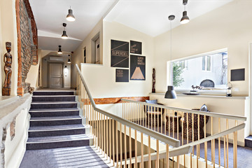 Staircase with gold rail in the modern hotel interior