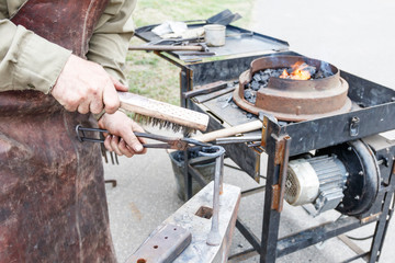 blacksmith. shows how the process of manufacturing metal products