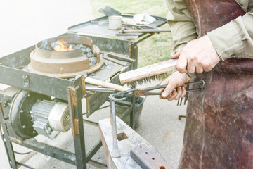 blacksmith. shows how the process of manufacturing metal products