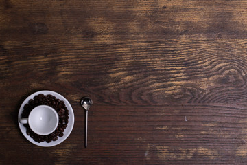Top view of white espresso coffee cup on white saucer