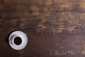 Top view of white espresso coffee cup with espresso coffee on white saucer