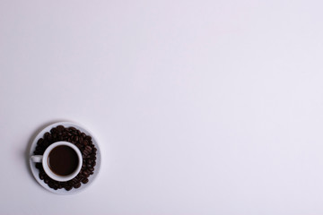 Obraz na płótnie Canvas Top view of white espresso coffee cup with espresso coffee on white saucer