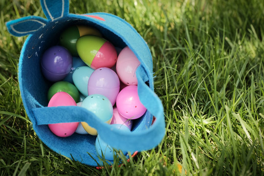 easter eggs in basket on grass