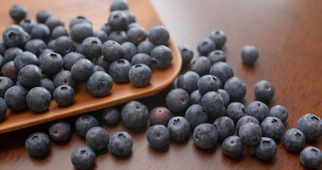 Stack of blueberry on the wooden plate