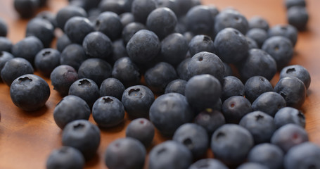Stack of blueberry on wooden plate