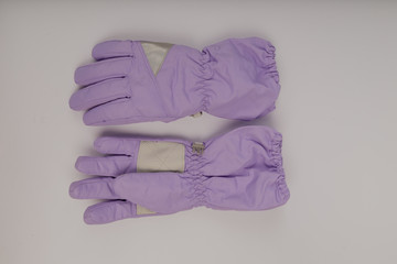 Children's winter gloves on a white background.
