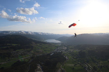 Fototapeta na wymiar Wingsuit skydiving over Norway