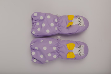 Children's winter gloves on a white background.