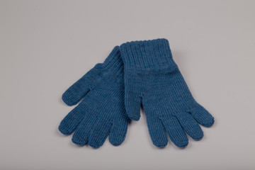 Children's winter gloves on a white background.