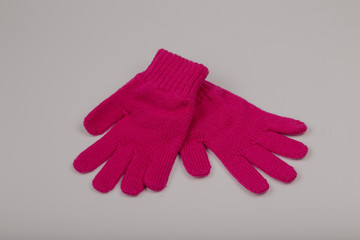 Children's winter gloves on a white background.