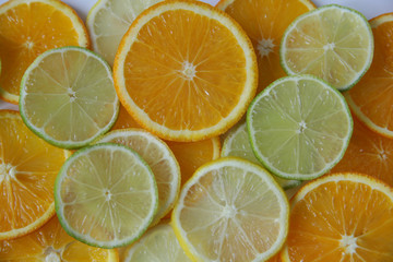 Flat lay. Top view. Orange, lime, lemon. Citrus fruit slices pattern, texture, background. Healthy...