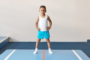 Childhood, sports and active healthy lifestyle concept. Horizontal image of serious self determined...