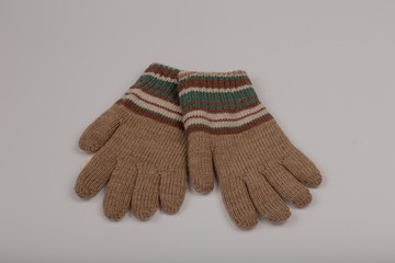 Children's winter gloves on a white background.