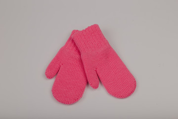 Children's winter gloves on a white background.