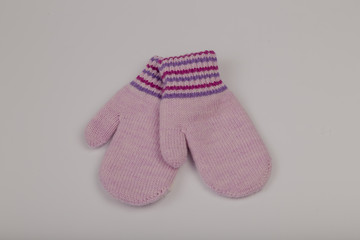 Children's winter gloves on a white background.