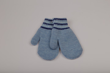 Children's winter gloves on a white background.