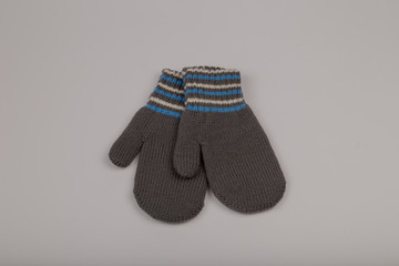Children's winter gloves on a white background.