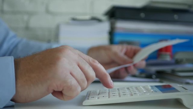 Accountant Job in Company Office Calculate Bills Using Adding Machine