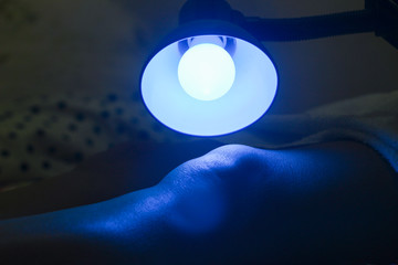 Patient receiving color therapy, chromotherapy on body treatment. Colorful lights stimulating the psyche.