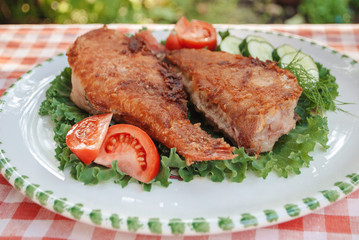 Food photo. Fried fish with vegetables