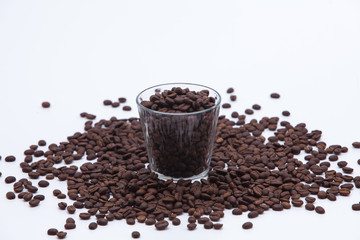 Coffee beans with a glass