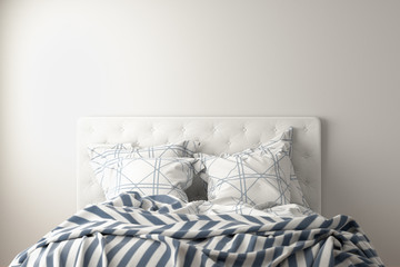 Bed with duvet, bedding and pillows isolated on white.