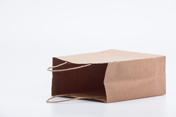 Empty recycle brown gift bag isolated on white background