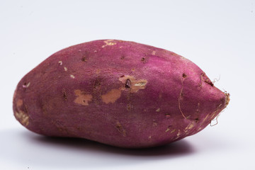 Red sweet potato isolated on white 