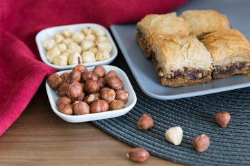 Turkish style vegan baklava or Antep baklava with nut,date fruit, pistachio for presentation and service and food photography. 