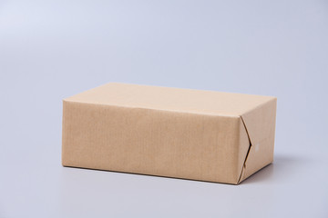 Brown gift box isolated on gray background