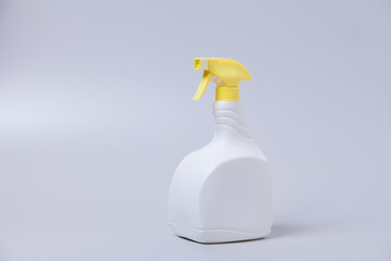 White spray bottle isolated over the white gray background
