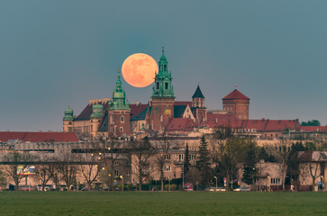 Fototapeta Wawel Castle and full moon, Krakow, Poland, seen from Blonia meadow obraz
