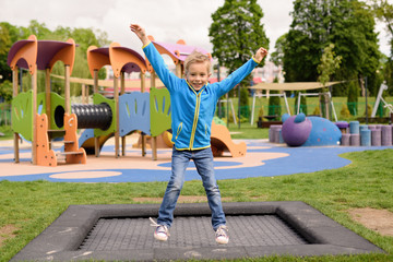 Naklejka premium Happy child on the playground.