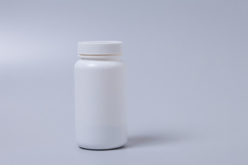  White medical container on gray background