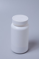  White medical container on gray background