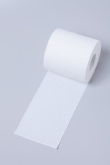 Toilet paper roll isolated on gray background