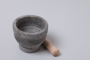 Stone mortar pestle on gray