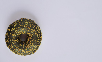 Delicious donuts on light pastel color background.