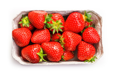 Fototapeta na wymiar Ripe strawberries in a carton box on a white background. View from above