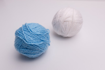 blue and white balls of thread-isolated
