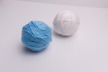 blue and white balls of thread-isolated