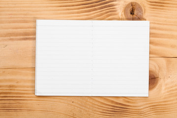 Open note book on wooden bench