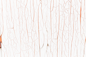 Pink and white cracked paint surface