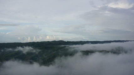 white clouds in the mountains are very beautiful, the atmosphere on a sunny morning