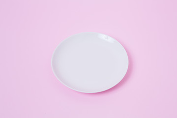 View from above plate on pink background